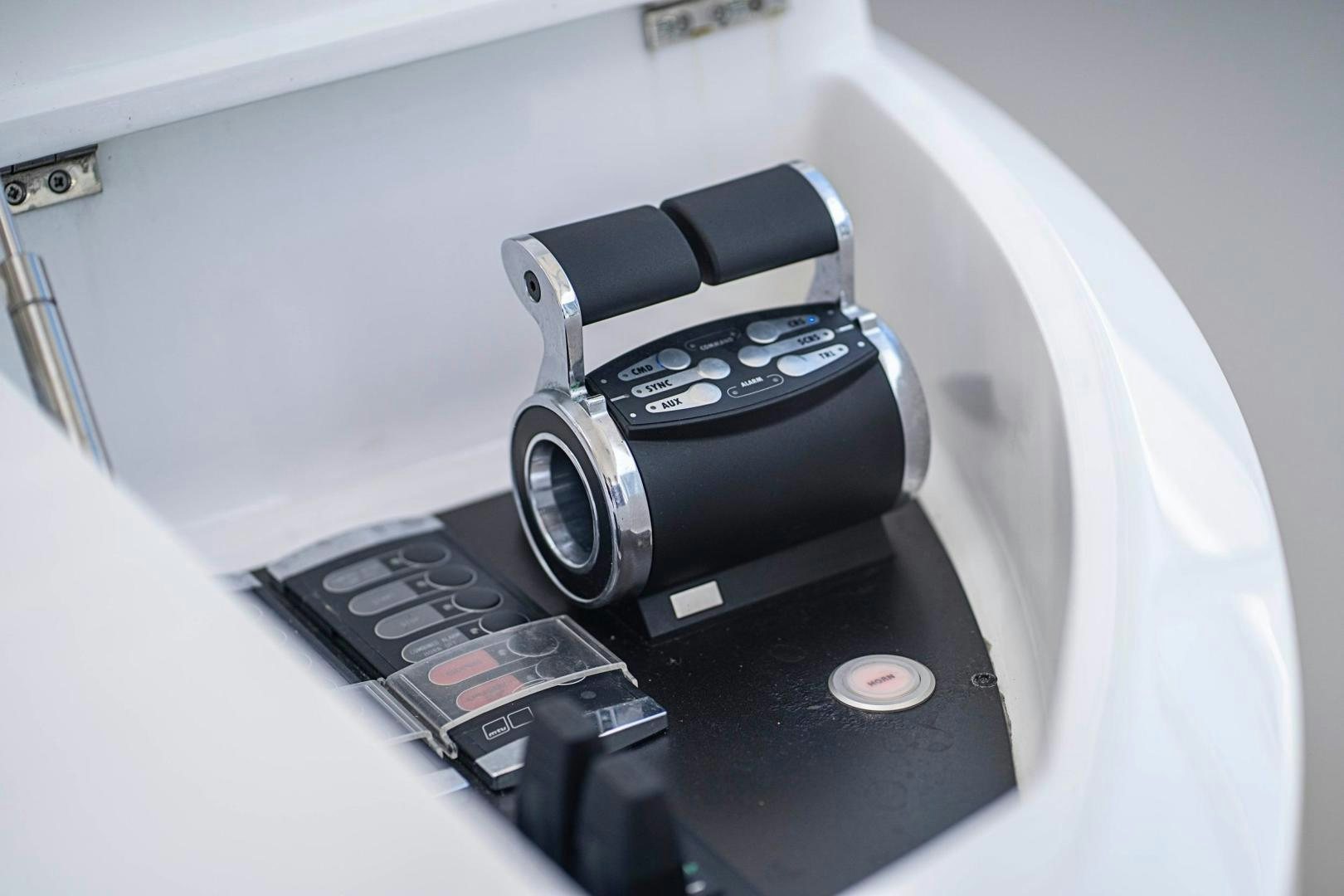 a black camera on a white surface aboard QUANTUM Yacht for Sale