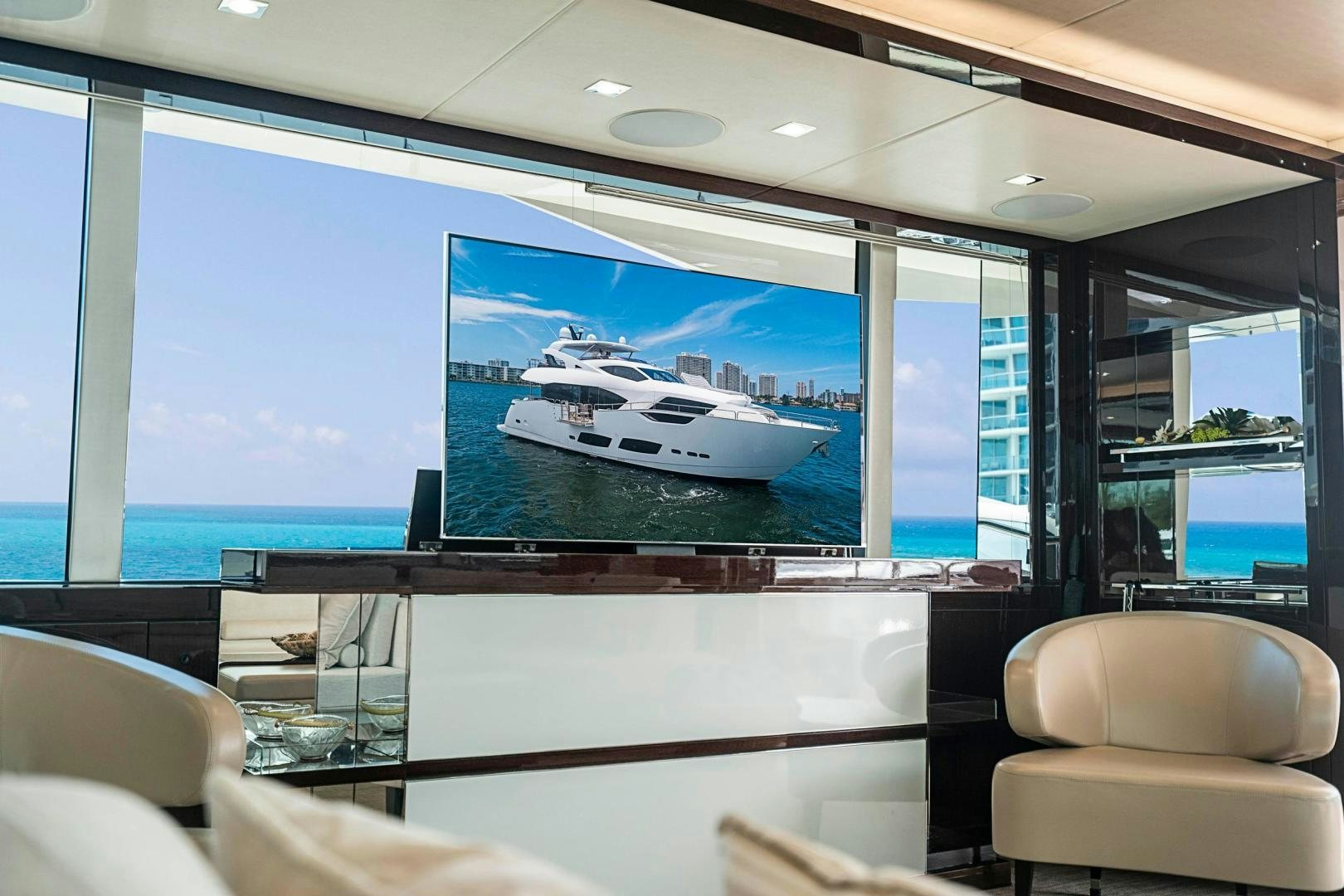 a large screen on a wall aboard QUANTUM Yacht for Sale
