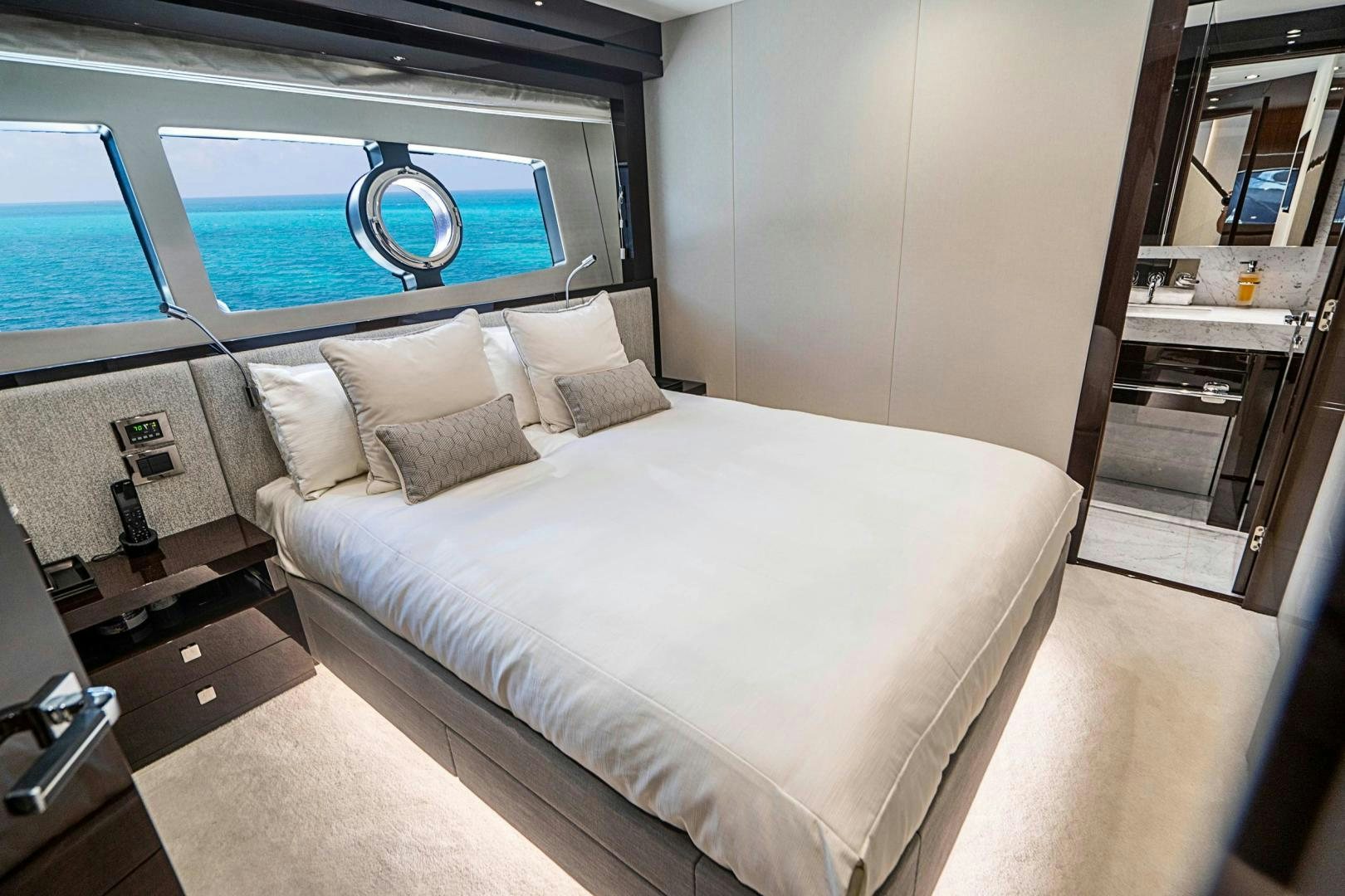 a bed with a white sheet aboard QUANTUM Yacht for Sale