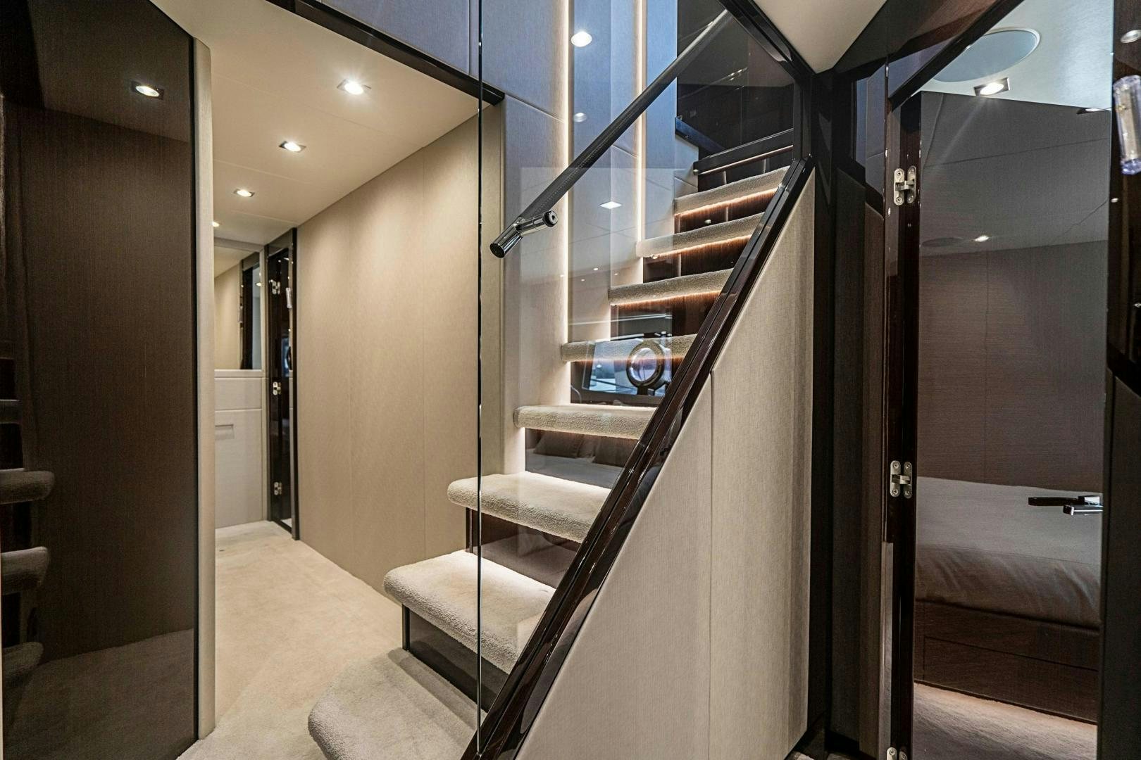 a hallway with a glass door aboard QUANTUM Yacht for Sale
