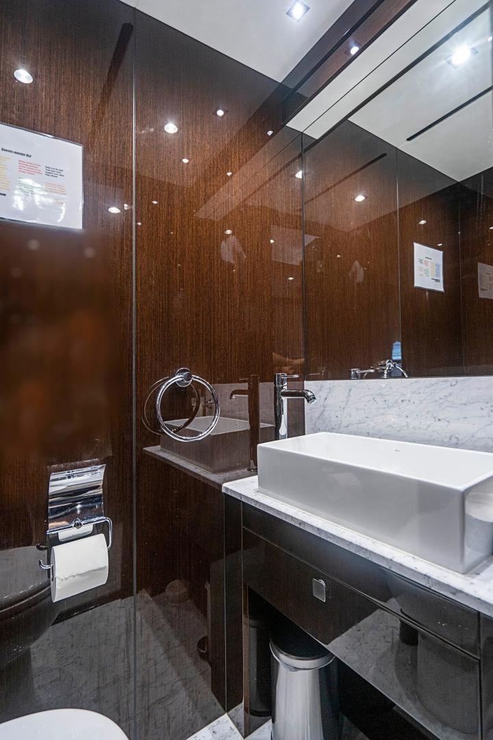a bathroom with a sink and a shower aboard QUANTUM Yacht for Sale