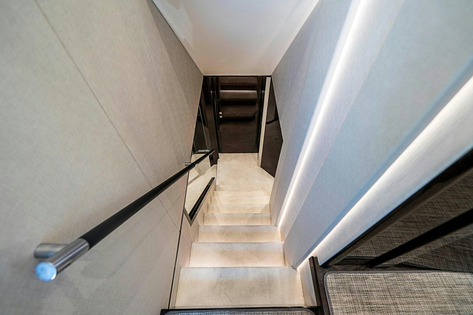 a flight of stairs leading to a door aboard QUANTUM Yacht for Sale