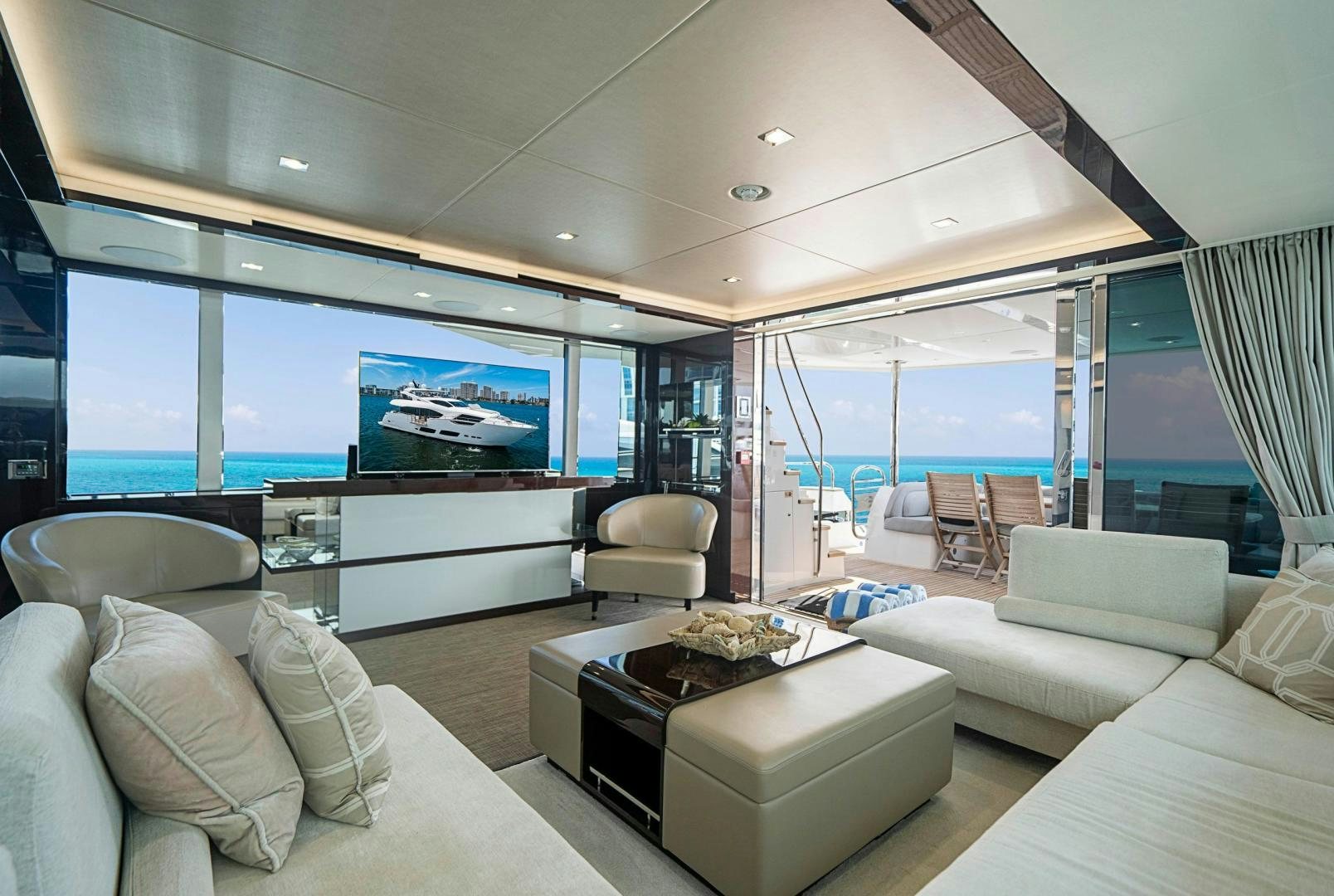 a living room with a large window aboard QUANTUM Yacht for Sale