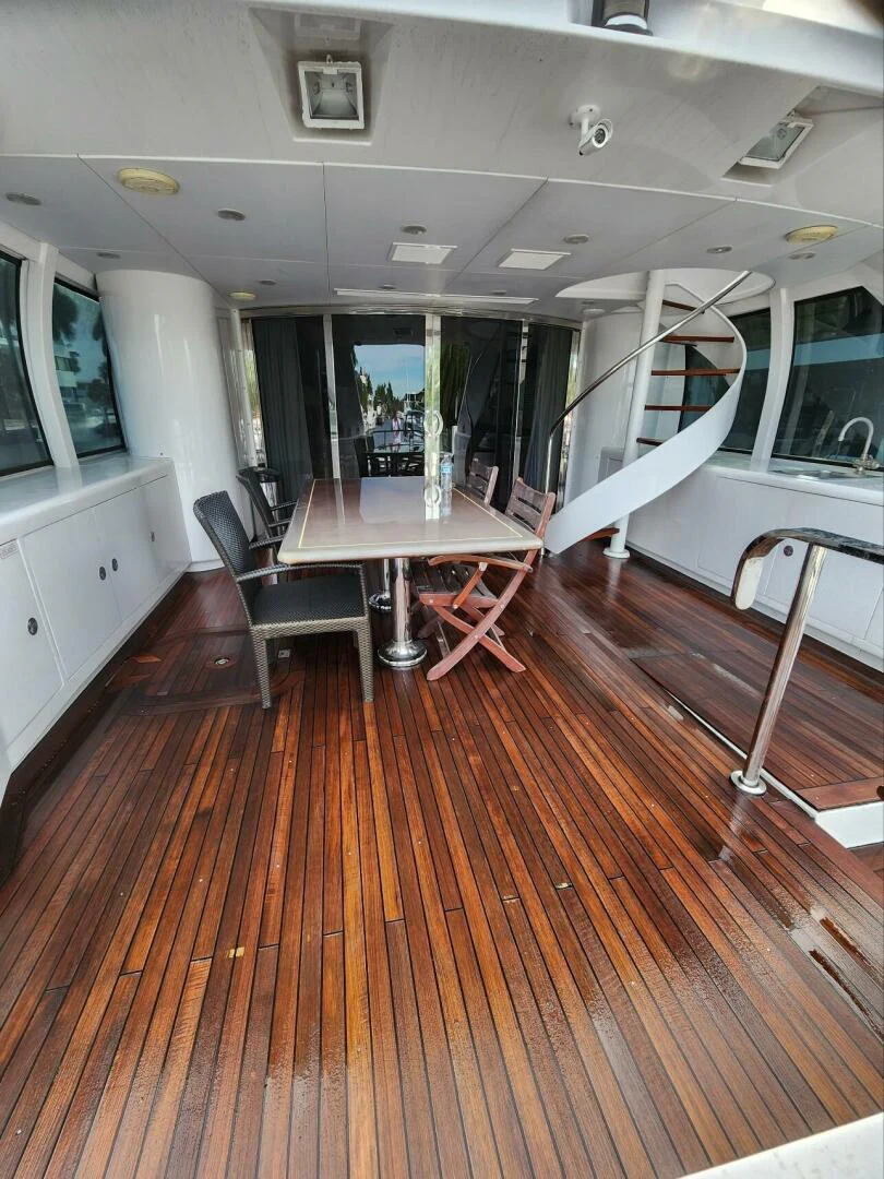 a room with a table and chairs aboard MARGAUX Yacht for Sale