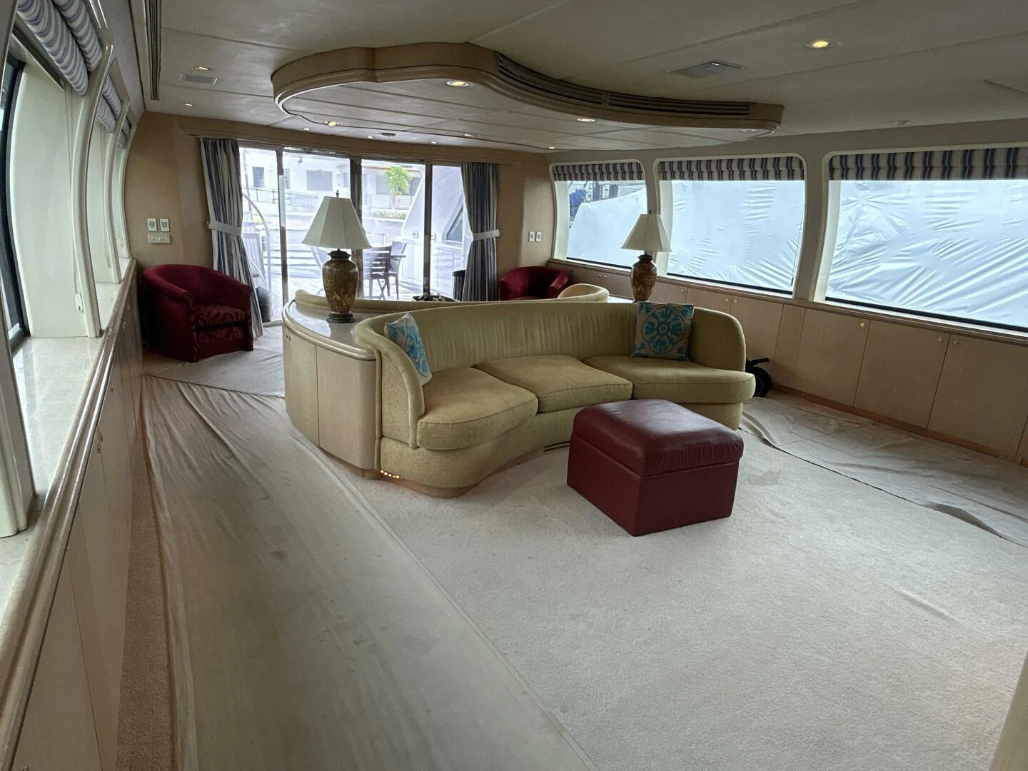a living room with a couch and a table aboard MARGAUX Yacht for Sale
