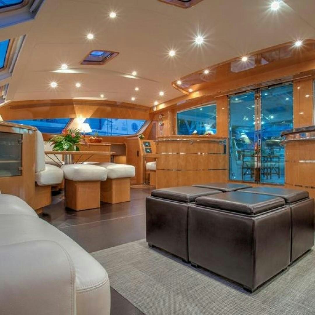 a living room with a large window aboard MATAU Yacht for Sale