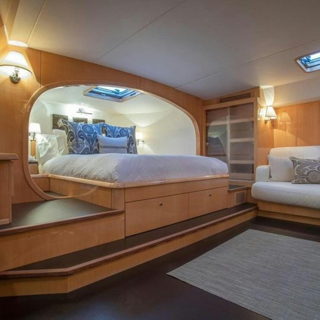 a bed in a room aboard MATAU Yacht for Sale