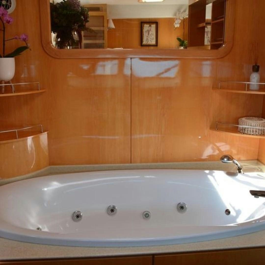 a bathtub with a sink aboard MATAU Yacht for Sale
