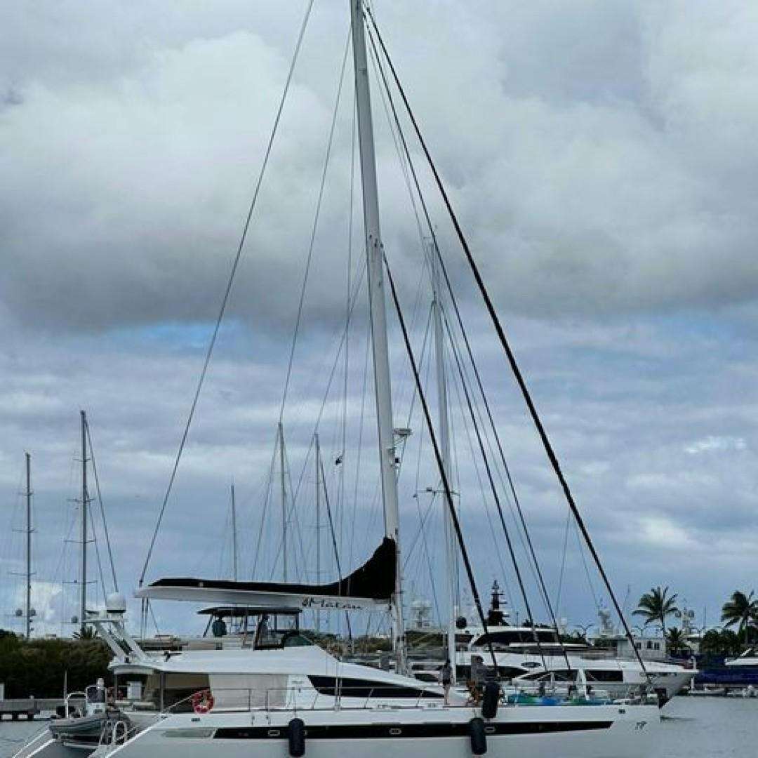 a sailboat in the water aboard MATAU Yacht for Sale