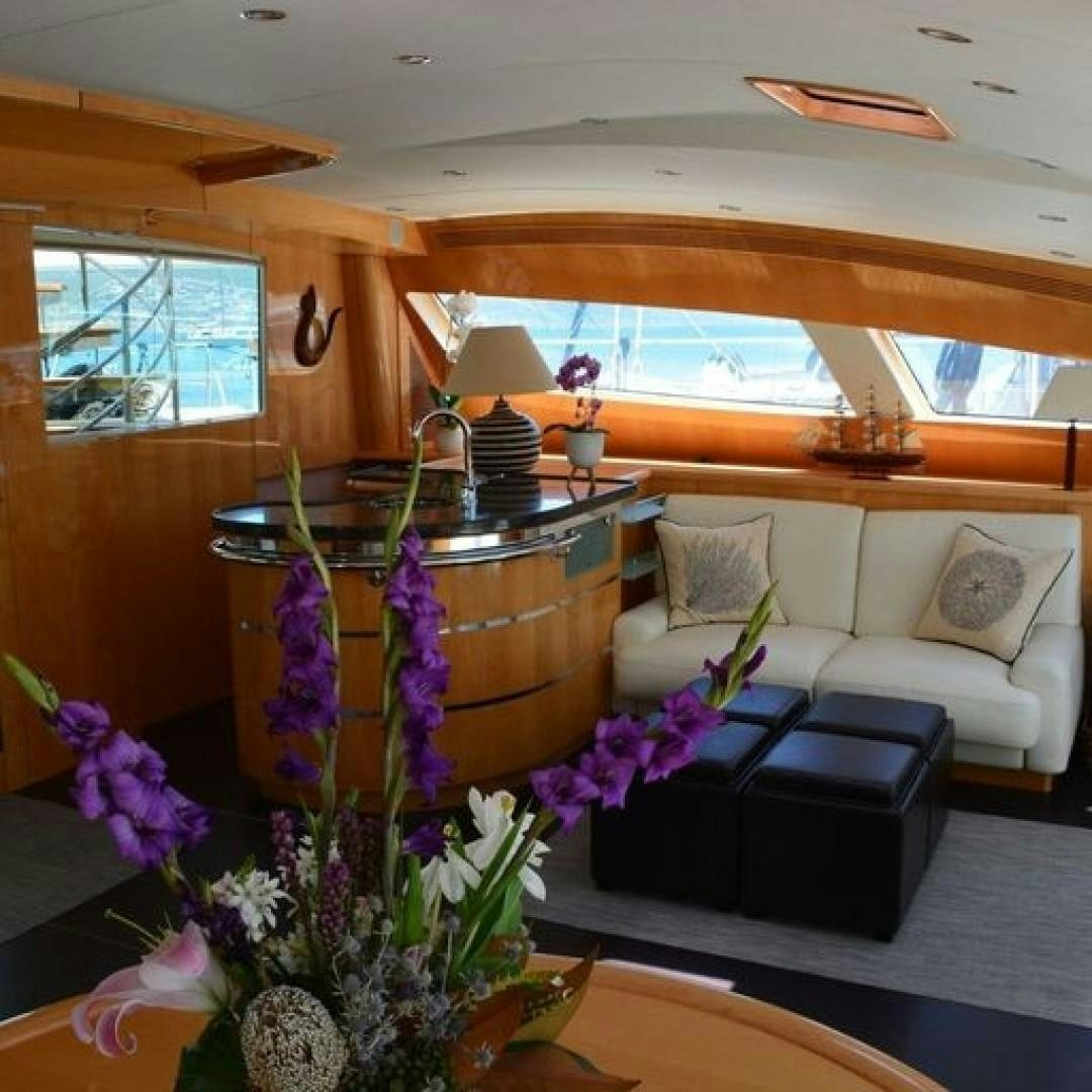 a living room with a large window aboard MATAU Yacht for Sale