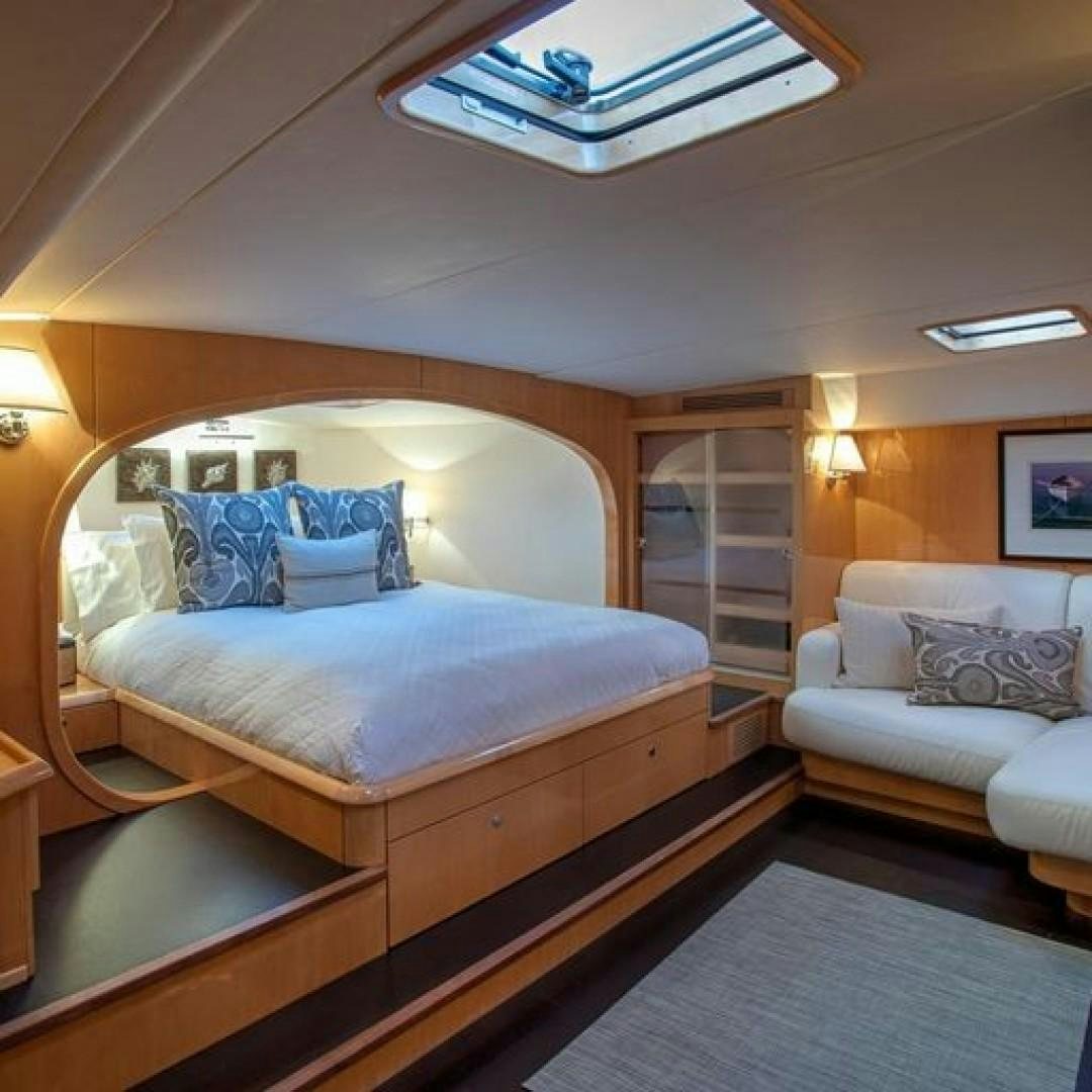 a bed in a room aboard MATAU Yacht for Sale