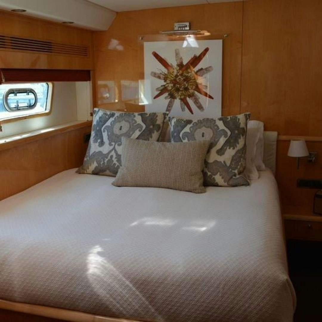 a bed with pillows aboard MATAU Yacht for Sale