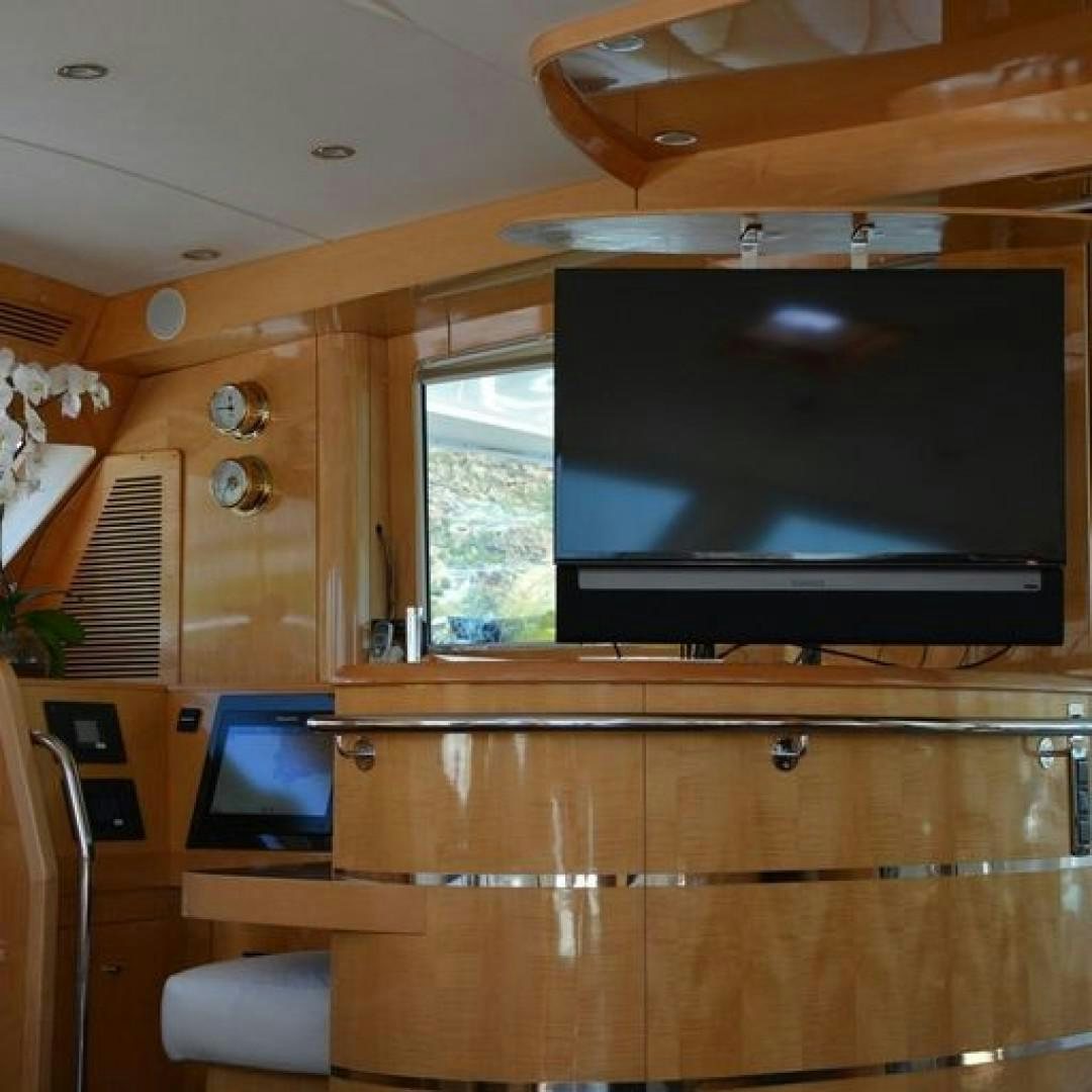 a tv on a cabinet aboard MATAU Yacht for Sale