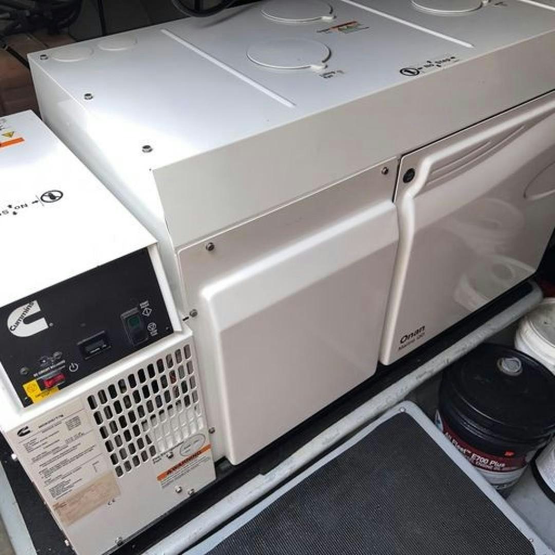 a white machine with a vent aboard MATAU Yacht for Sale