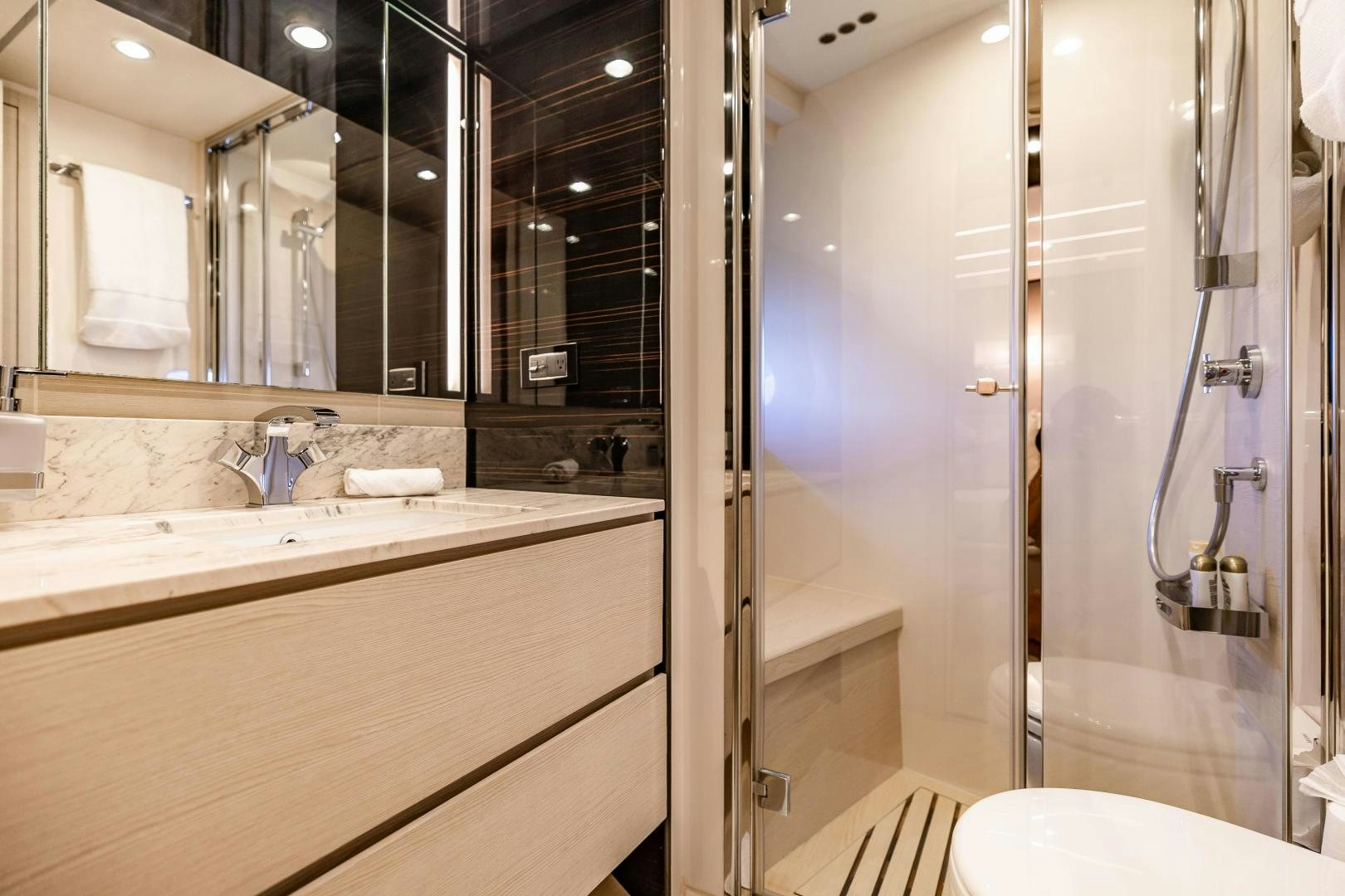 a bathroom with a large mirror aboard MIREYA Yacht for Sale