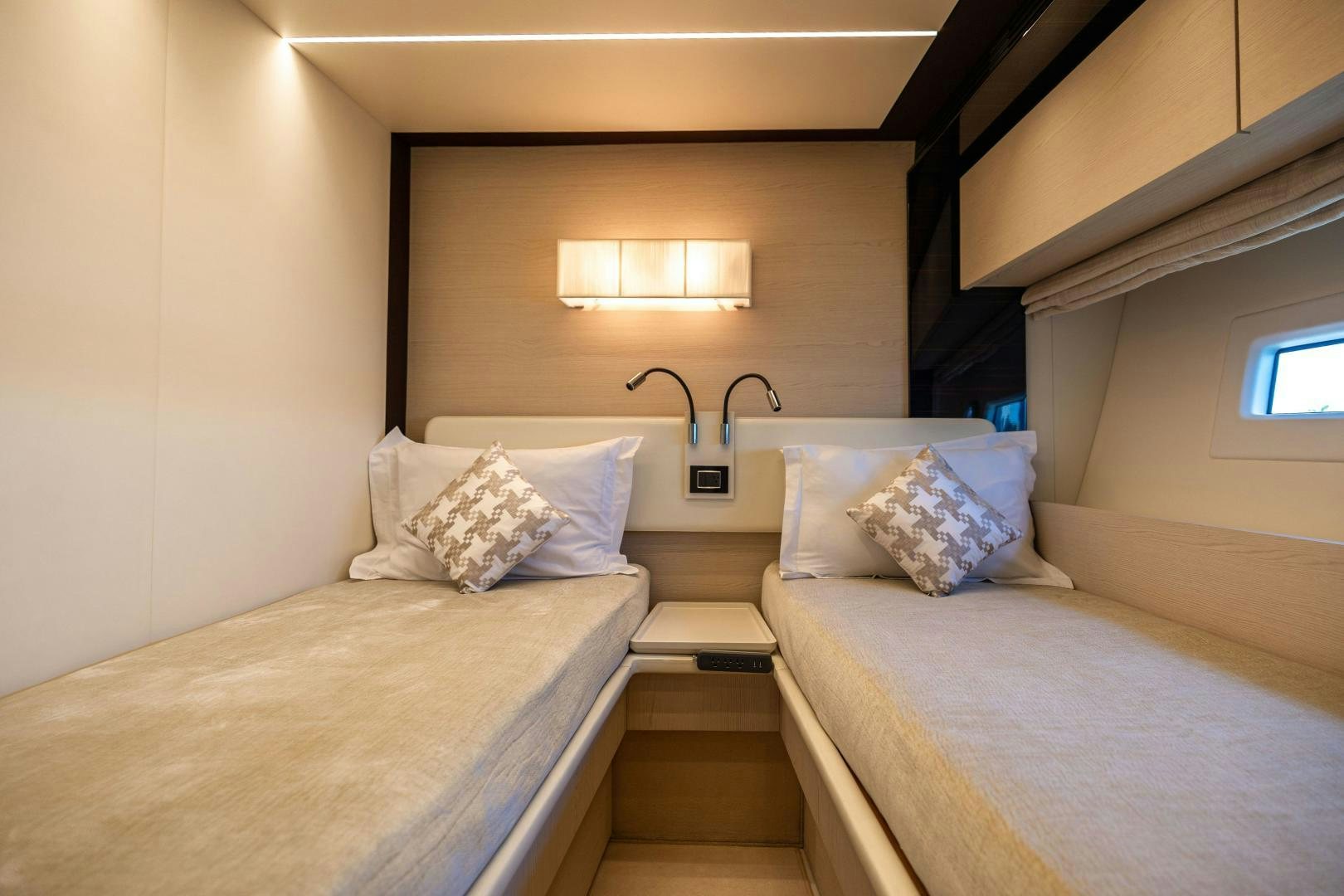 a couple of beds in a room aboard MIREYA Yacht for Sale