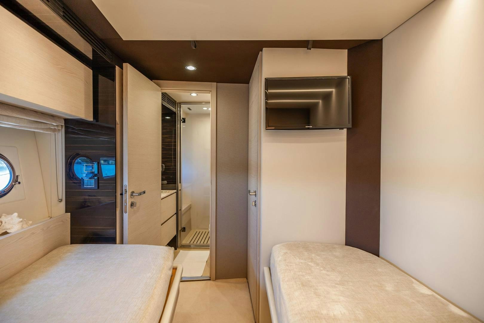 a bedroom with a bed and a door aboard MIREYA Yacht for Sale