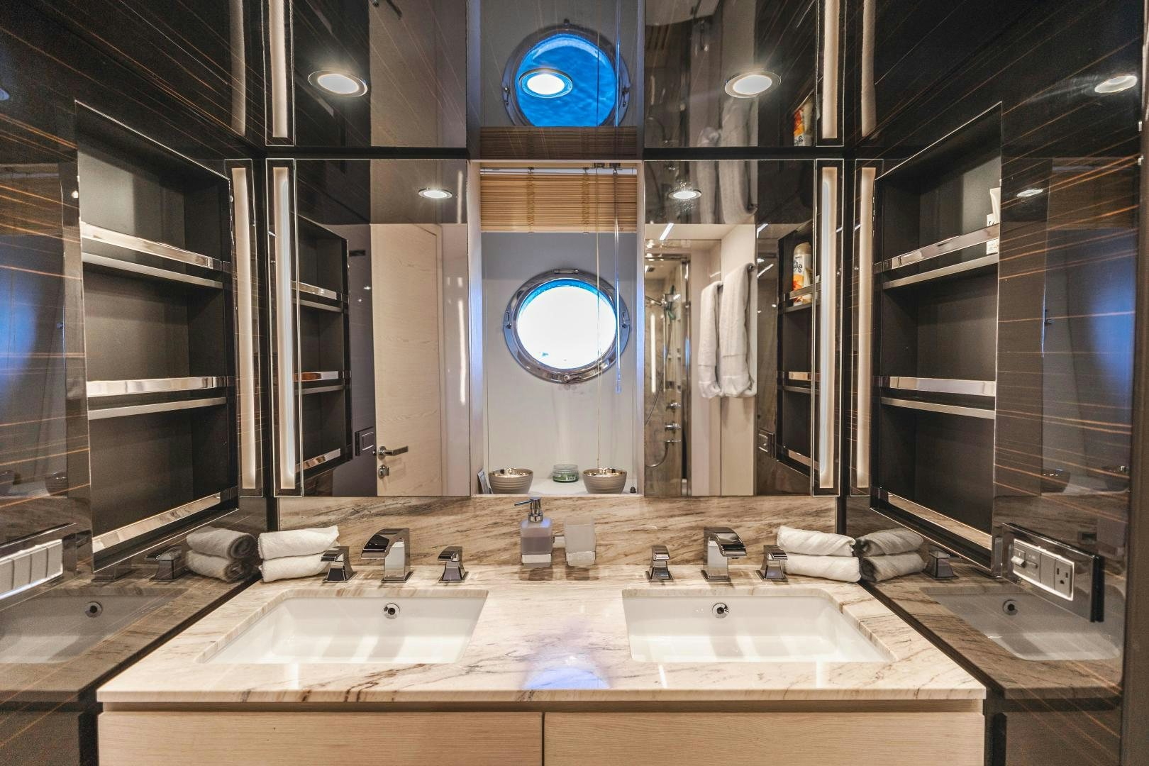 a bathroom with sinks and mirrors aboard MIREYA Yacht for Sale