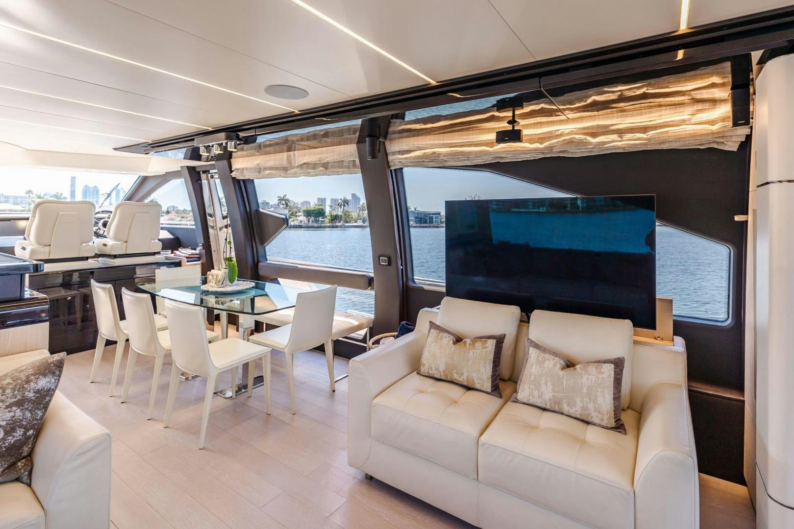 a room with a couch and a table and chairs aboard MIREYA Yacht for Sale