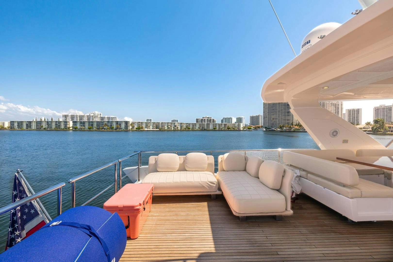 a deck with chairs and a body of water in the background aboard MIREYA Yacht for Sale