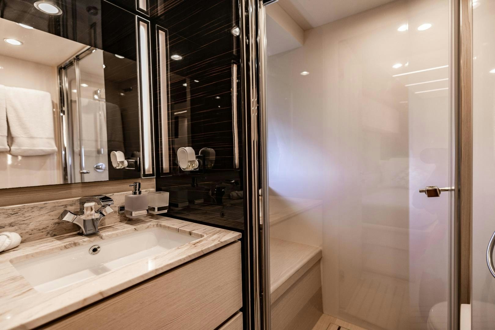 a bathroom with a sink and a mirror aboard MIREYA Yacht for Sale