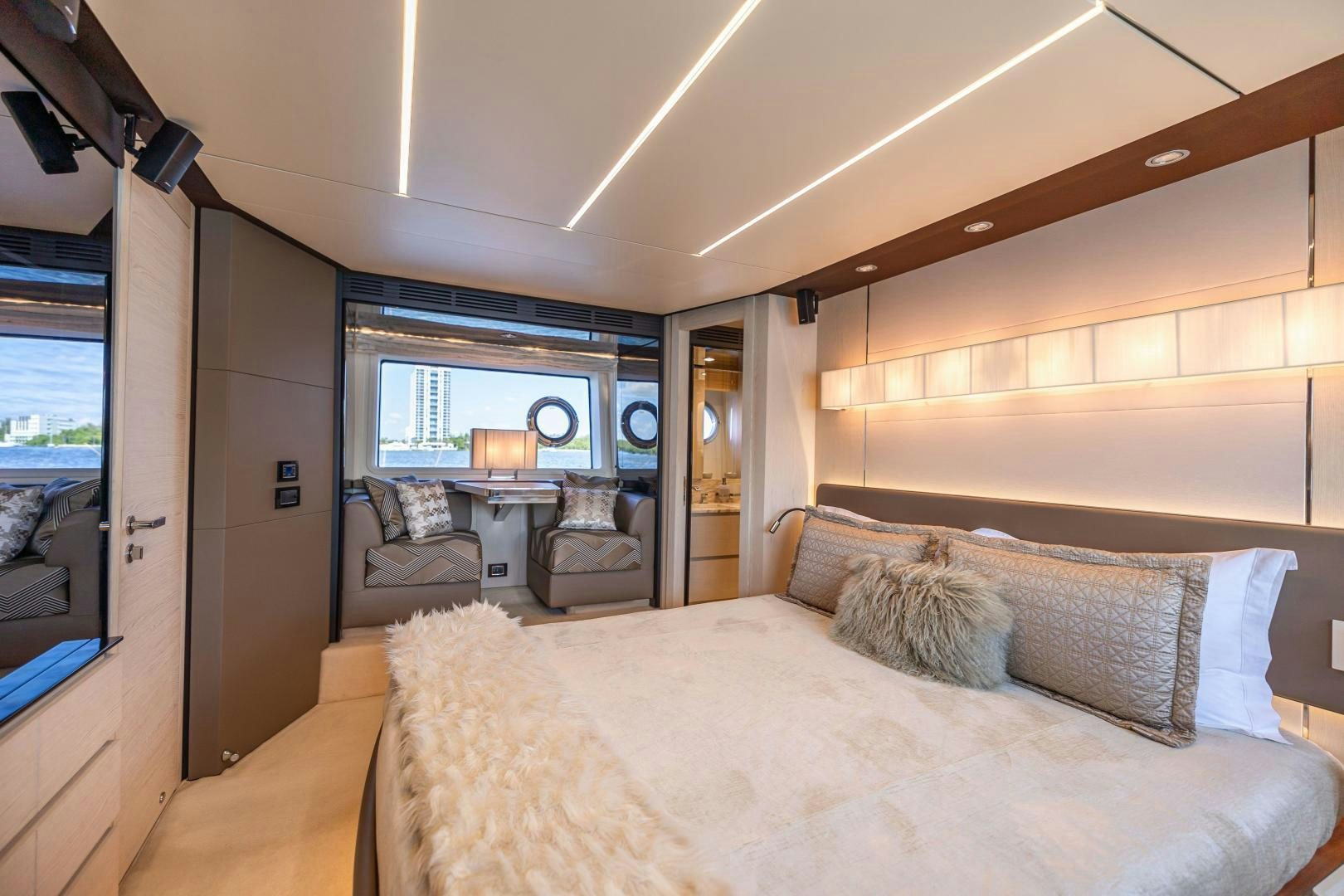 a bedroom with a bed and a large window aboard MIREYA Yacht for Sale