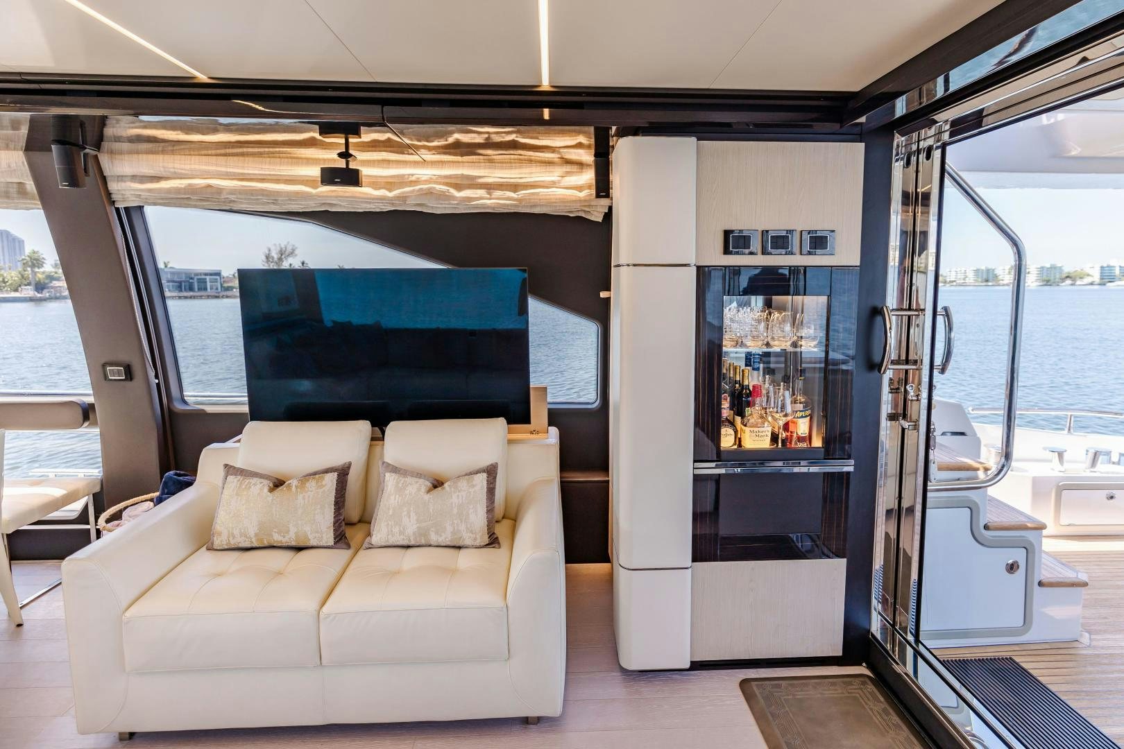 a room with a couch and a large glass door aboard MIREYA Yacht for Sale