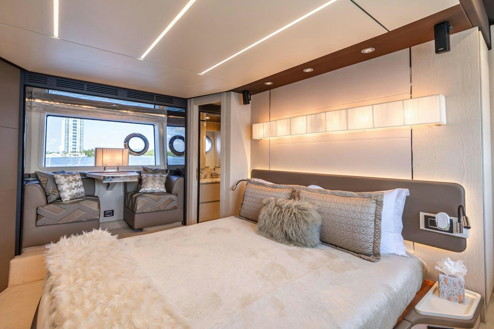 a bedroom with a bed and a couch aboard MIREYA Yacht for Sale