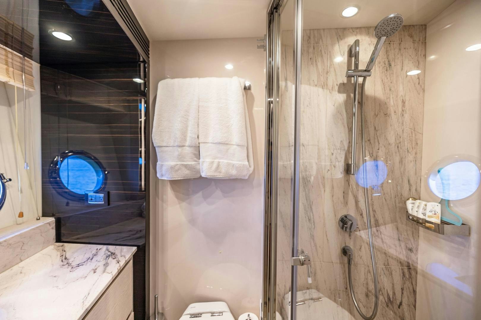 a bathroom with a shower and a sink aboard MIREYA Yacht for Sale