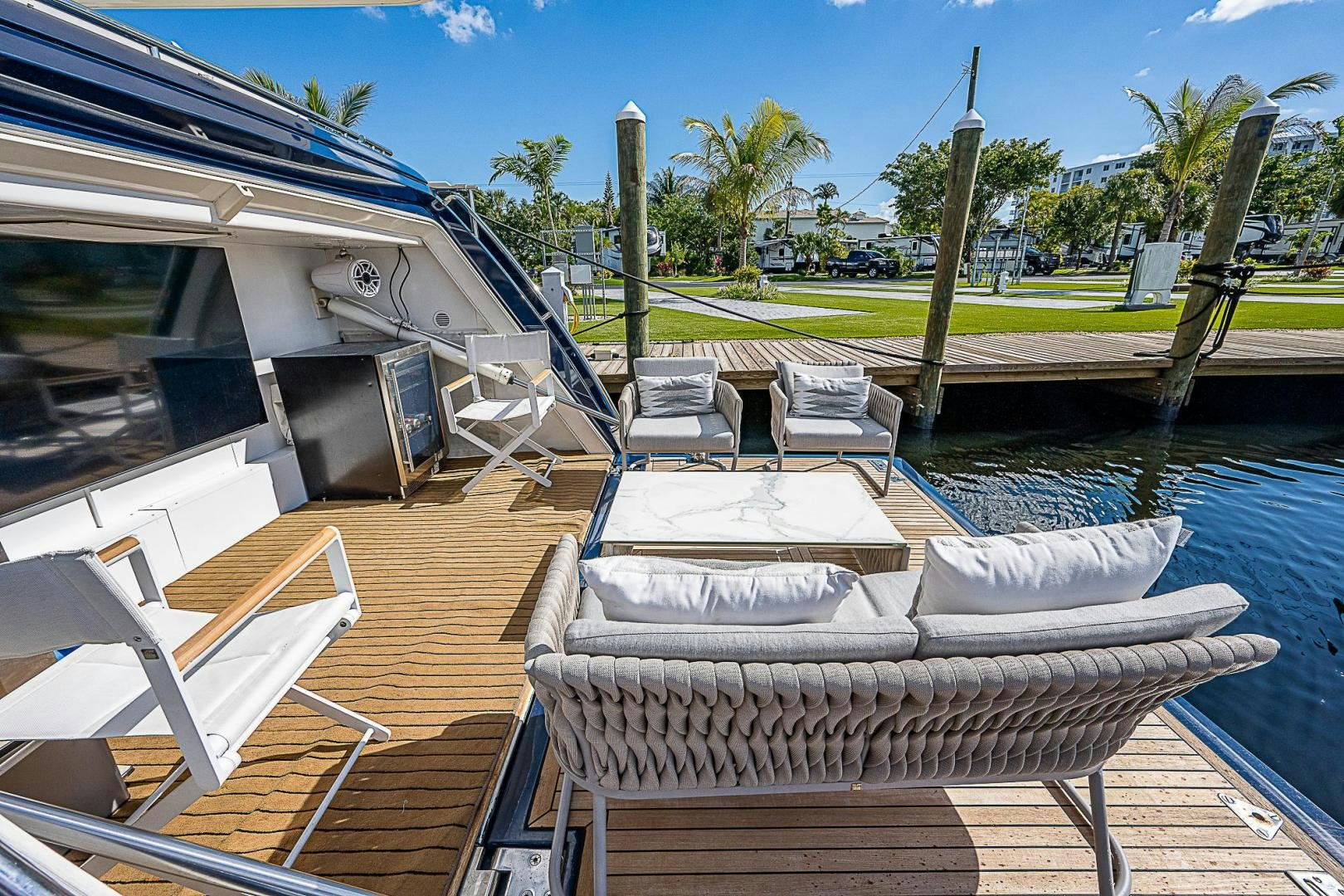 a deck with chairs and a pool aboard LA BELLA VITA Yacht for Sale