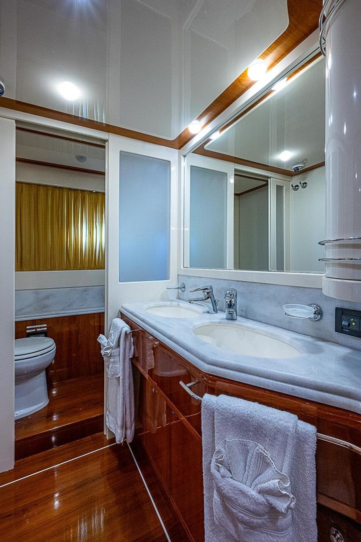 a bathroom with a sink and a mirror aboard LA BELLA VITA Yacht for Sale