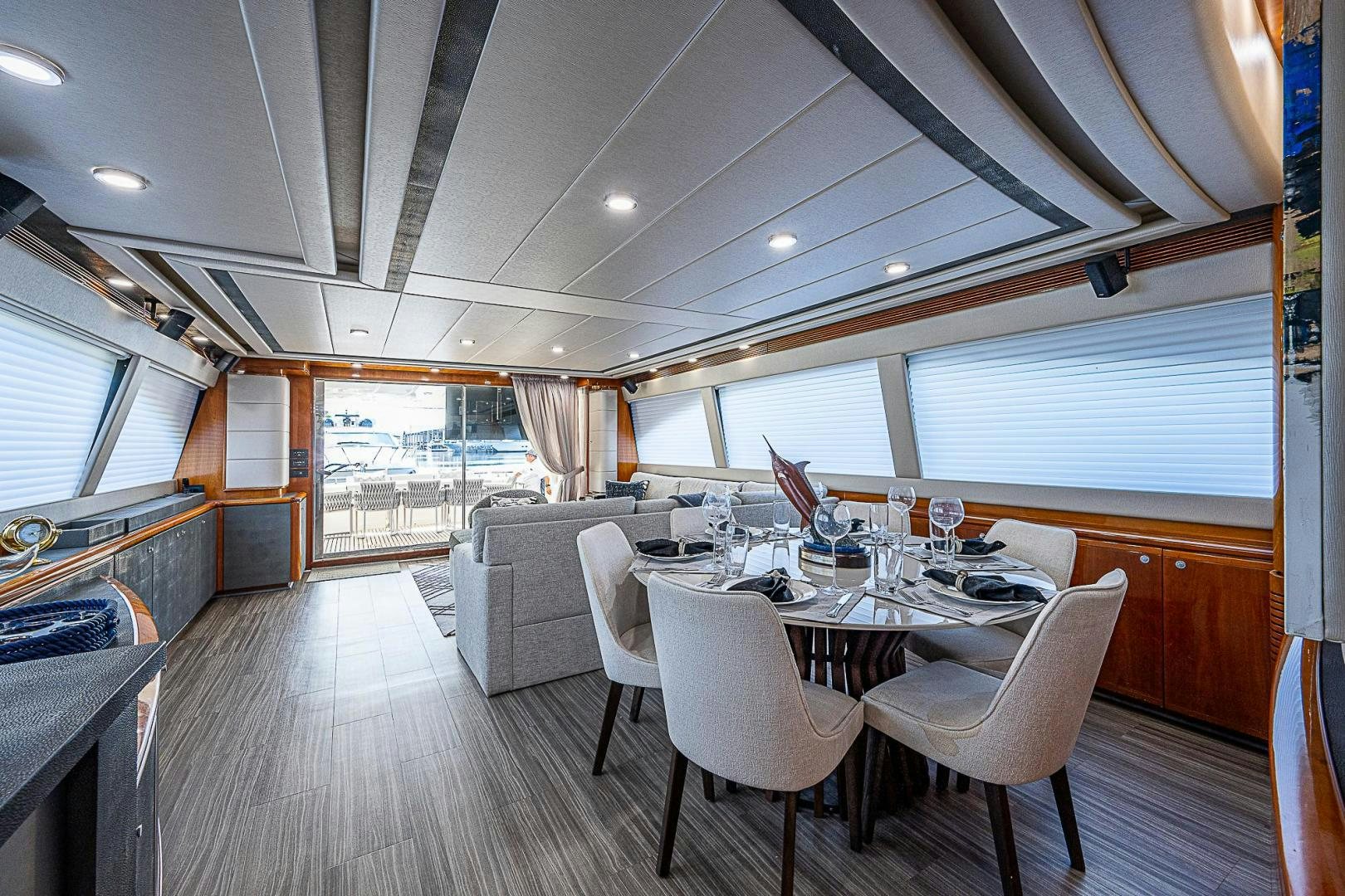 a large dining table in a room aboard LA BELLA VITA Yacht for Sale