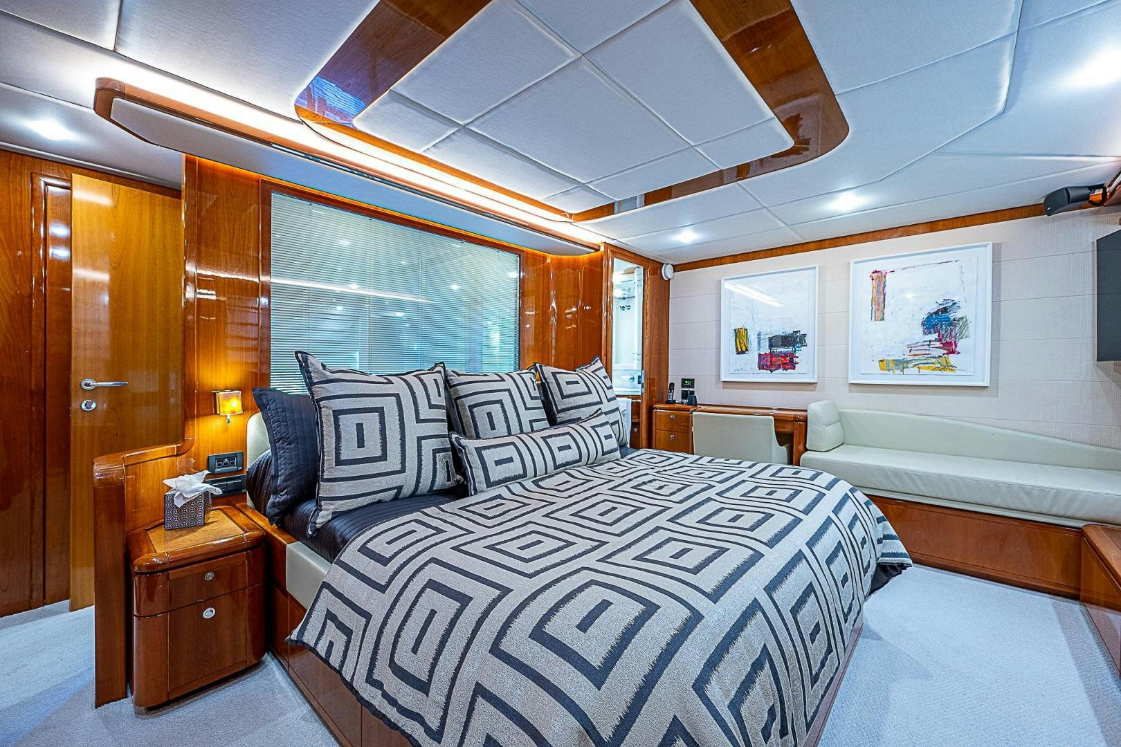a large bedroom with a large bed aboard LA BELLA VITA Yacht for Sale
