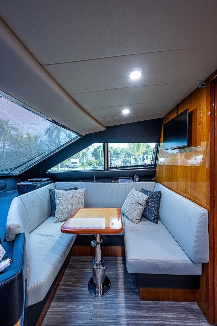 a living room with a couch and a table aboard LA BELLA VITA Yacht for Sale