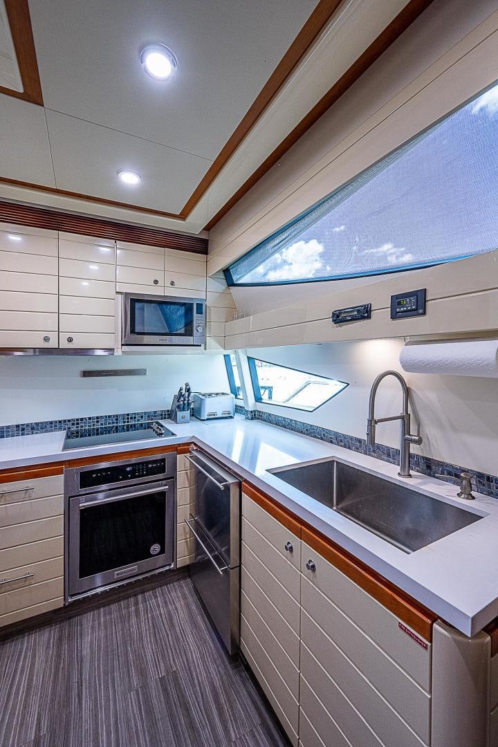 a kitchen with a stove and oven aboard LA BELLA VITA Yacht for Sale