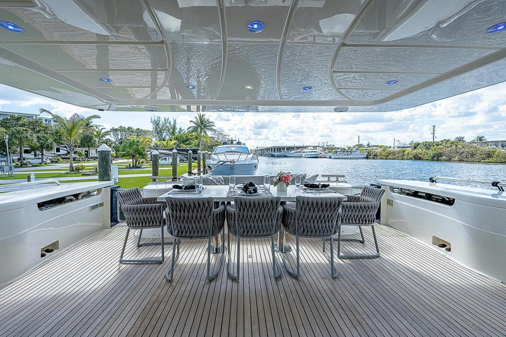 a table and chairs on a deck aboard LA BELLA VITA Yacht for Sale