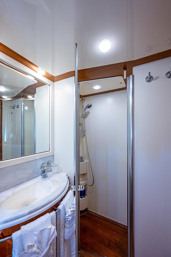 a bathroom with a sink and a shower aboard LA BELLA VITA Yacht for Sale