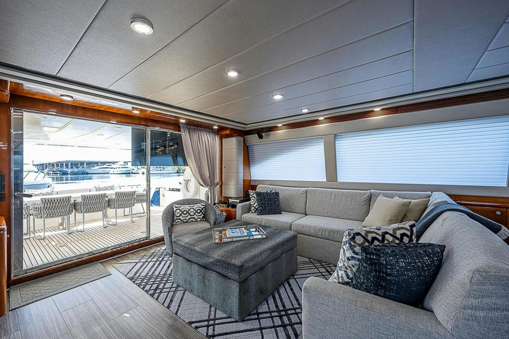 a living room with a large balcony aboard LA BELLA VITA Yacht for Sale