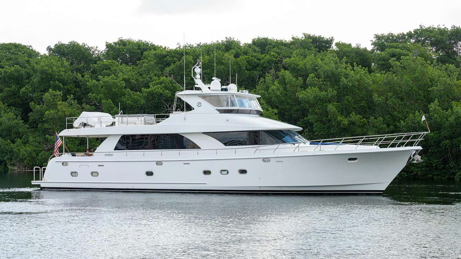 a white boat on water aboard BARNSTAR Yacht for Sale