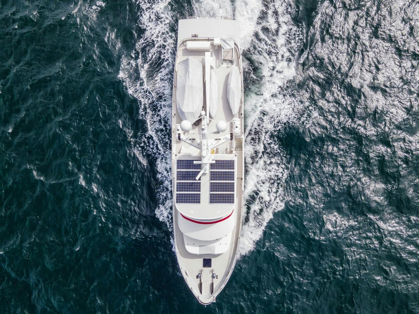 a white boat in the water aboard CHEEMAUN Yacht for Sale