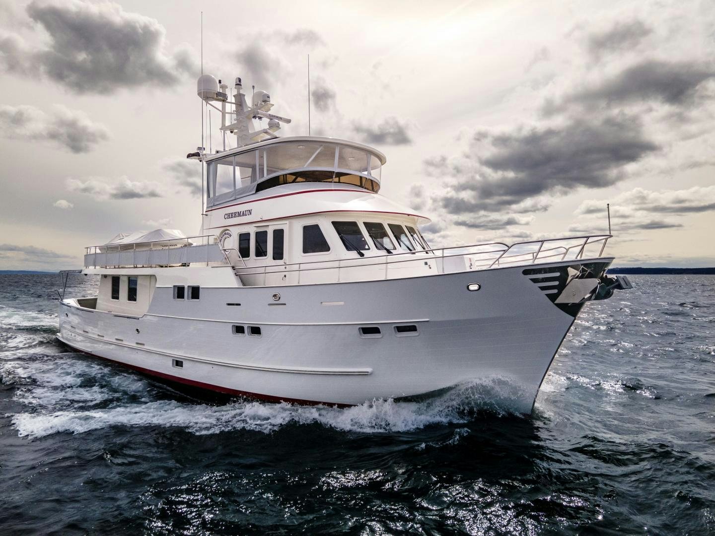 a white boat in the water aboard CHEEMAUN Yacht for Sale