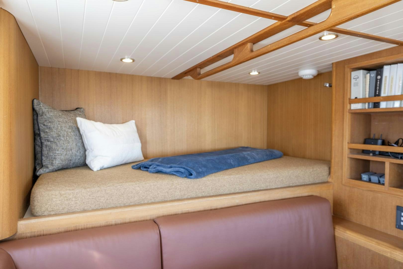 a couch with pillows aboard CHEEMAUN Yacht for Sale