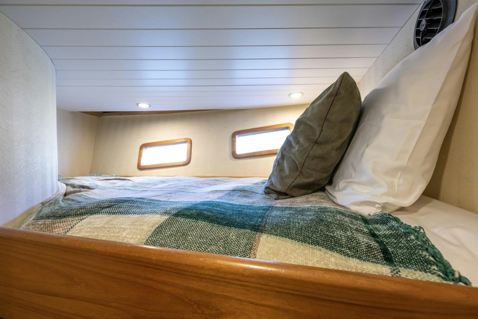 a bed with a pillow and a pillow on it aboard CHEEMAUN Yacht for Sale