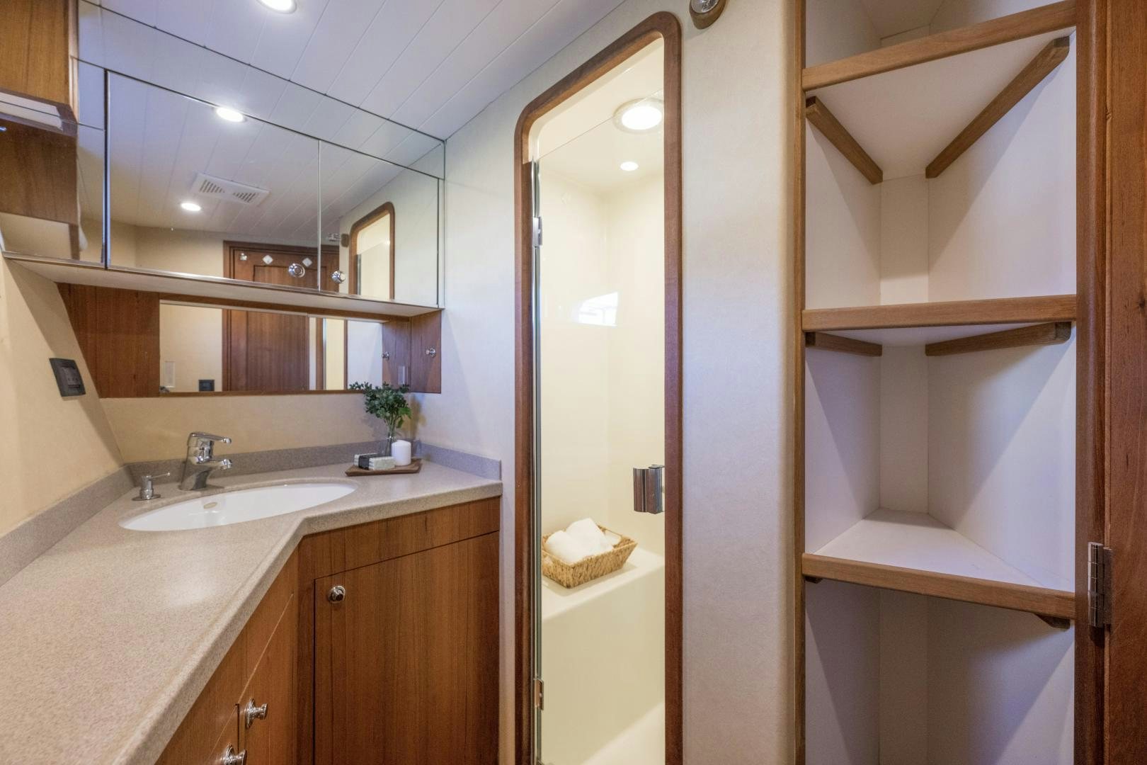 a bathroom with a glass door aboard CHEEMAUN Yacht for Sale