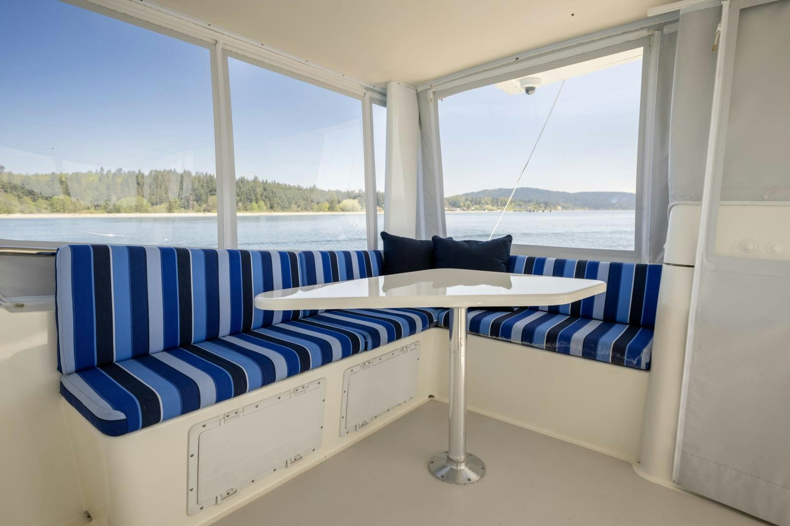 a room with a couch and a window aboard CHEEMAUN Yacht for Sale