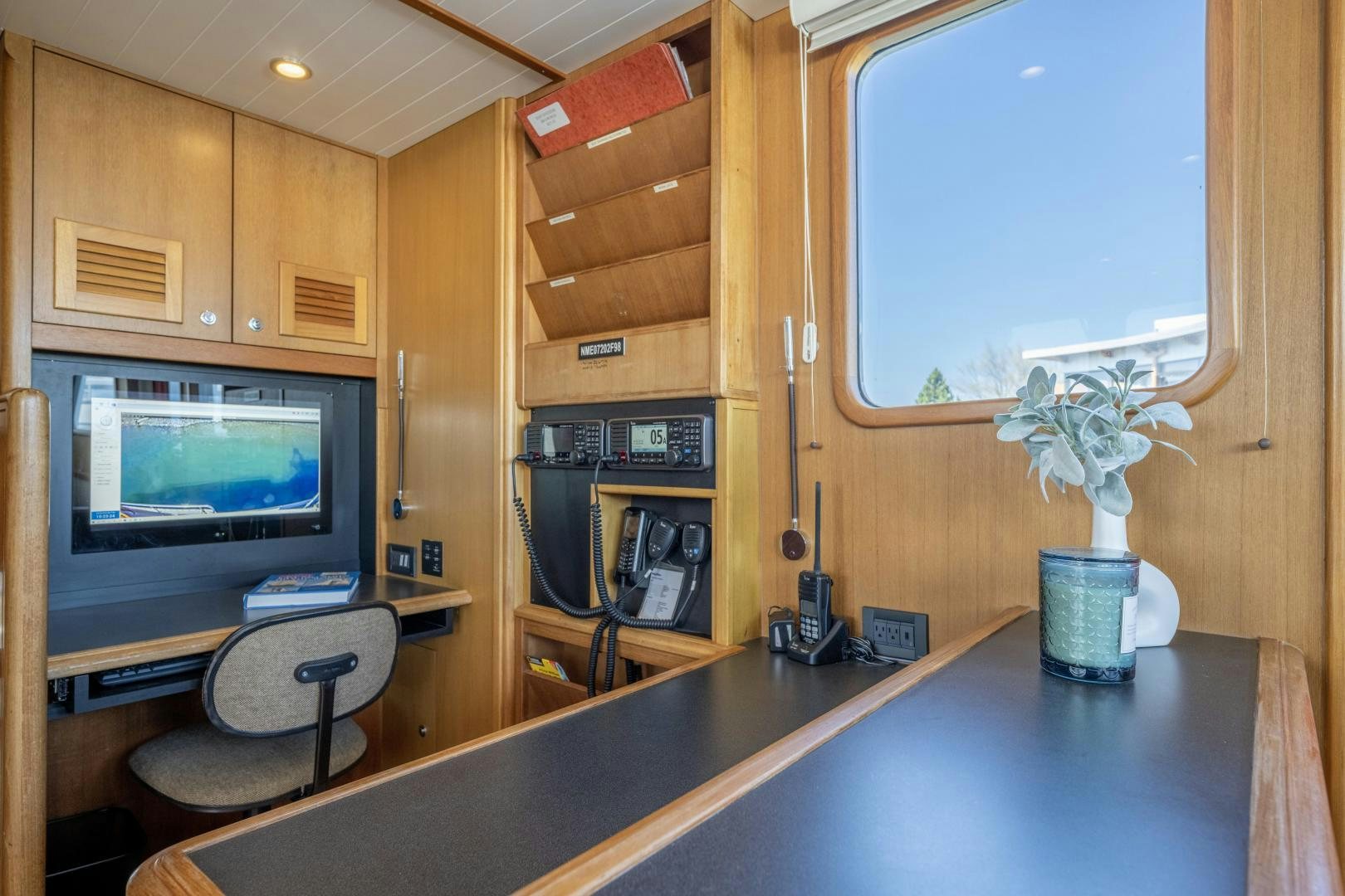a kitchen with a large tv aboard CHEEMAUN Yacht for Sale