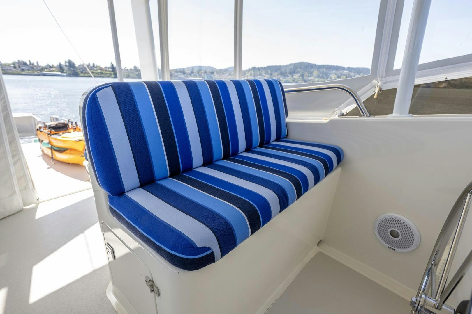 a blue and white chair on a boat aboard CHEEMAUN Yacht for Sale