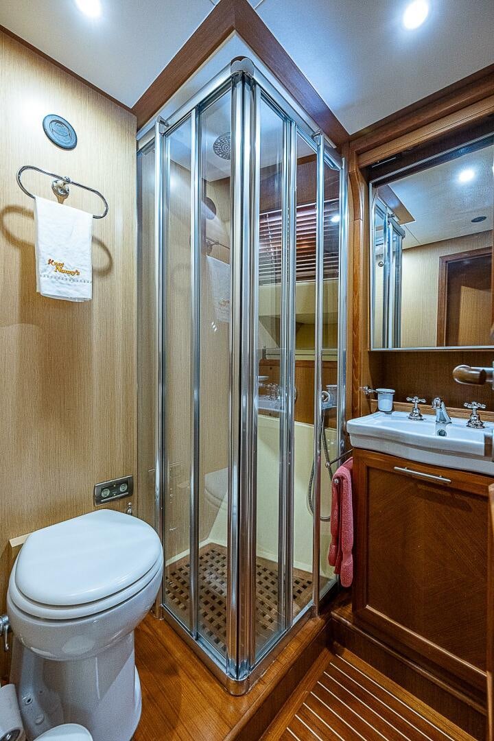 a bathroom with a glass shower aboard KNOT NANNY'S Yacht for Sale