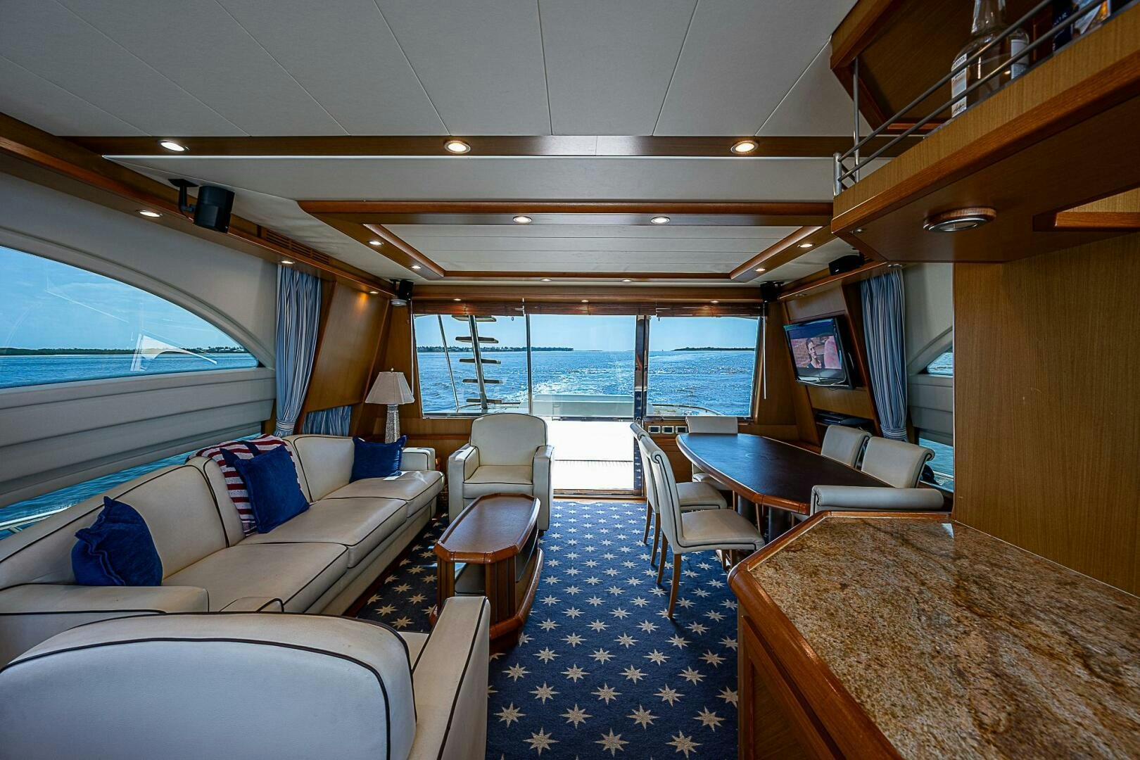 a living room with a large window aboard KNOT NANNY'S Yacht for Sale