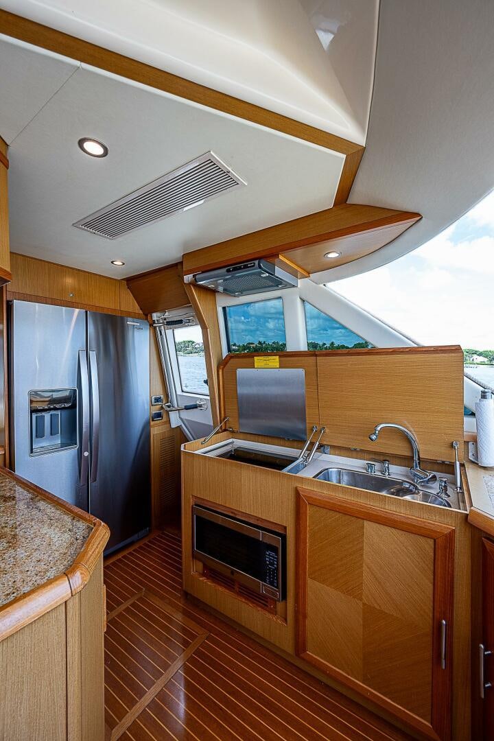 a kitchen with a large island aboard KNOT NANNY'S Yacht for Sale
